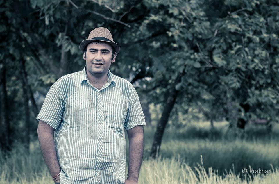 Prakhar in the forest — hat and striped shirt